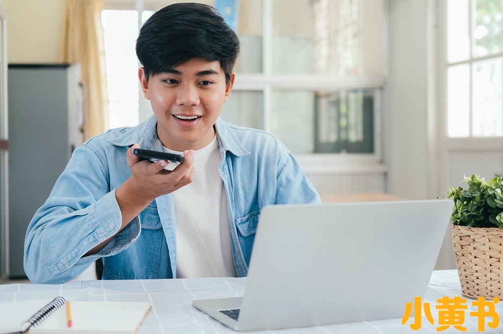 Young-guy-using-devices-to-VOI.jpg